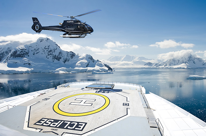 Scenic Eclipse Helicopter taking off in Antarctica