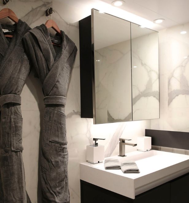 Dressing gowns hanging up in bathroom on board Scenic Cruise Ship