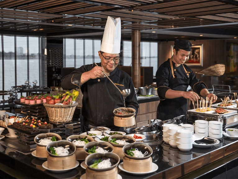 Chefs preparing food in Crystal Dining on board the Scenic Spirit ship 