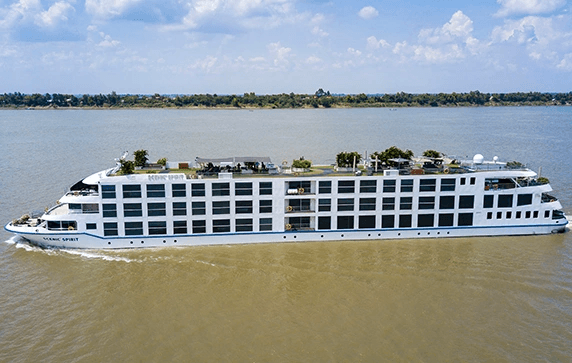 The Scenic Spirit ship cruising on the Mekong River with blue sky above
