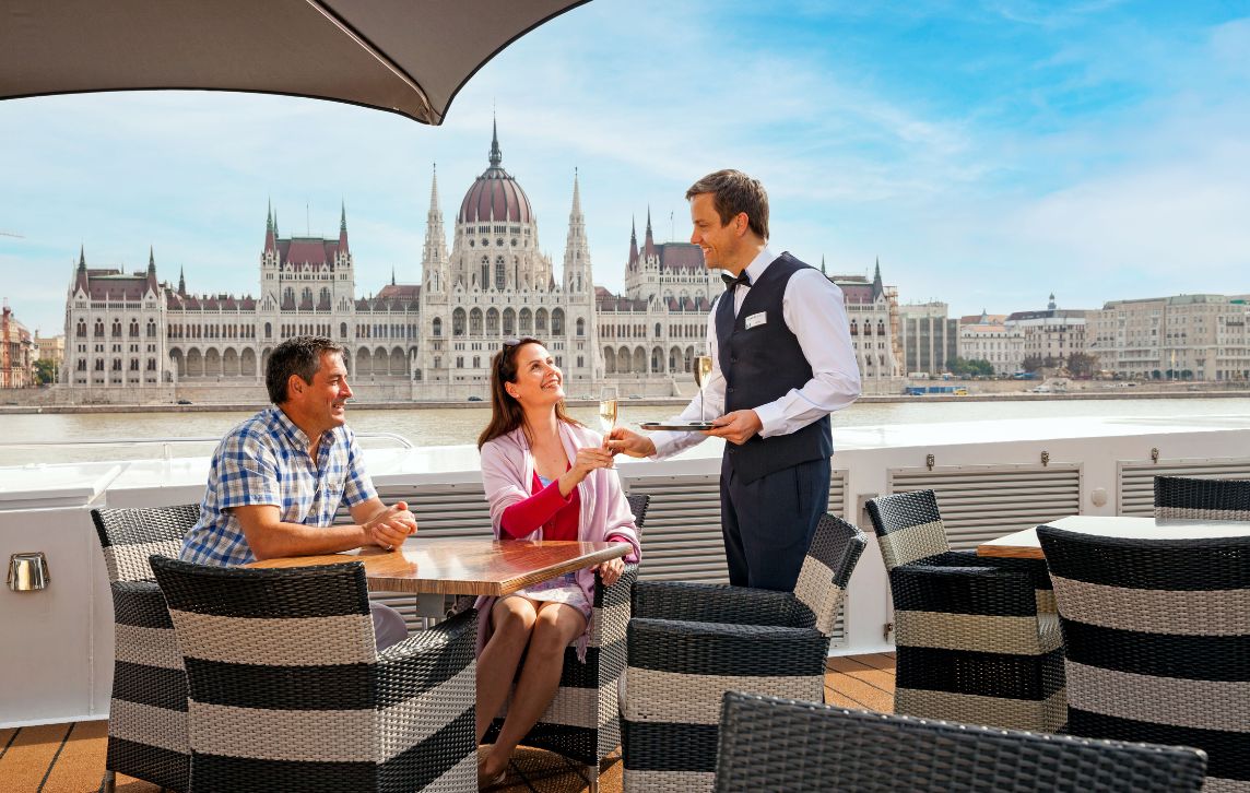 Couple being waited on outside Budapest Parliament