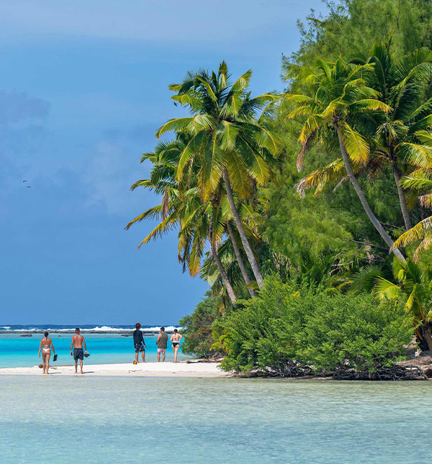 people on a tropical beach in Aitutaki Cook Islands