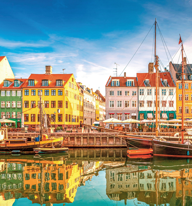 Copenhagen’s waterfront with boats and coloured houses