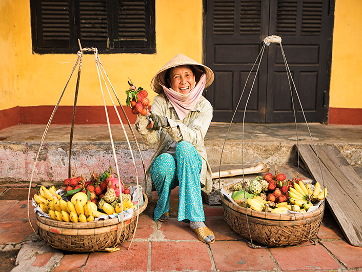 Market trader with fruit