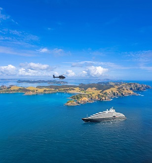 Scenic Eclipse Helicopter flying over Urupukapuka Island, Bay of Islands, New Zealand